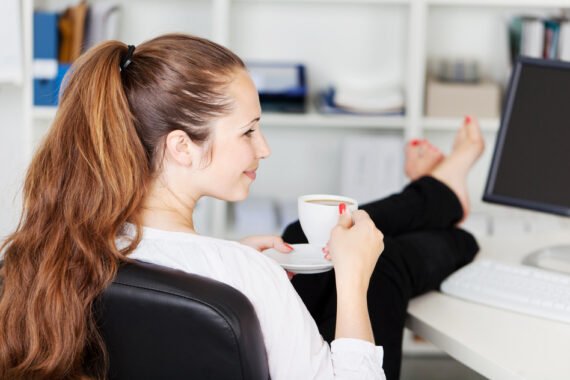 Woman taking a coffee break in her office